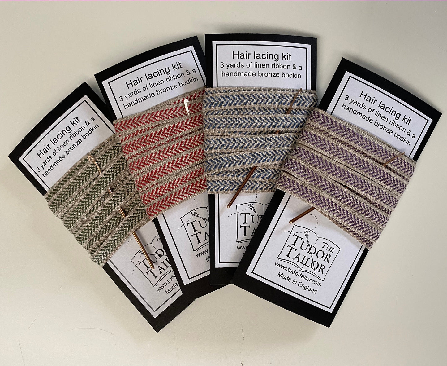 Hair lacing kit in various colours for Tudor or Elizabethan reenactment featuring bronze bodkin and linen ribbon