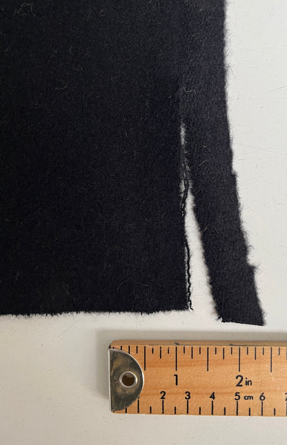 Half yard of Black wool broadcloth, small tear on selvage