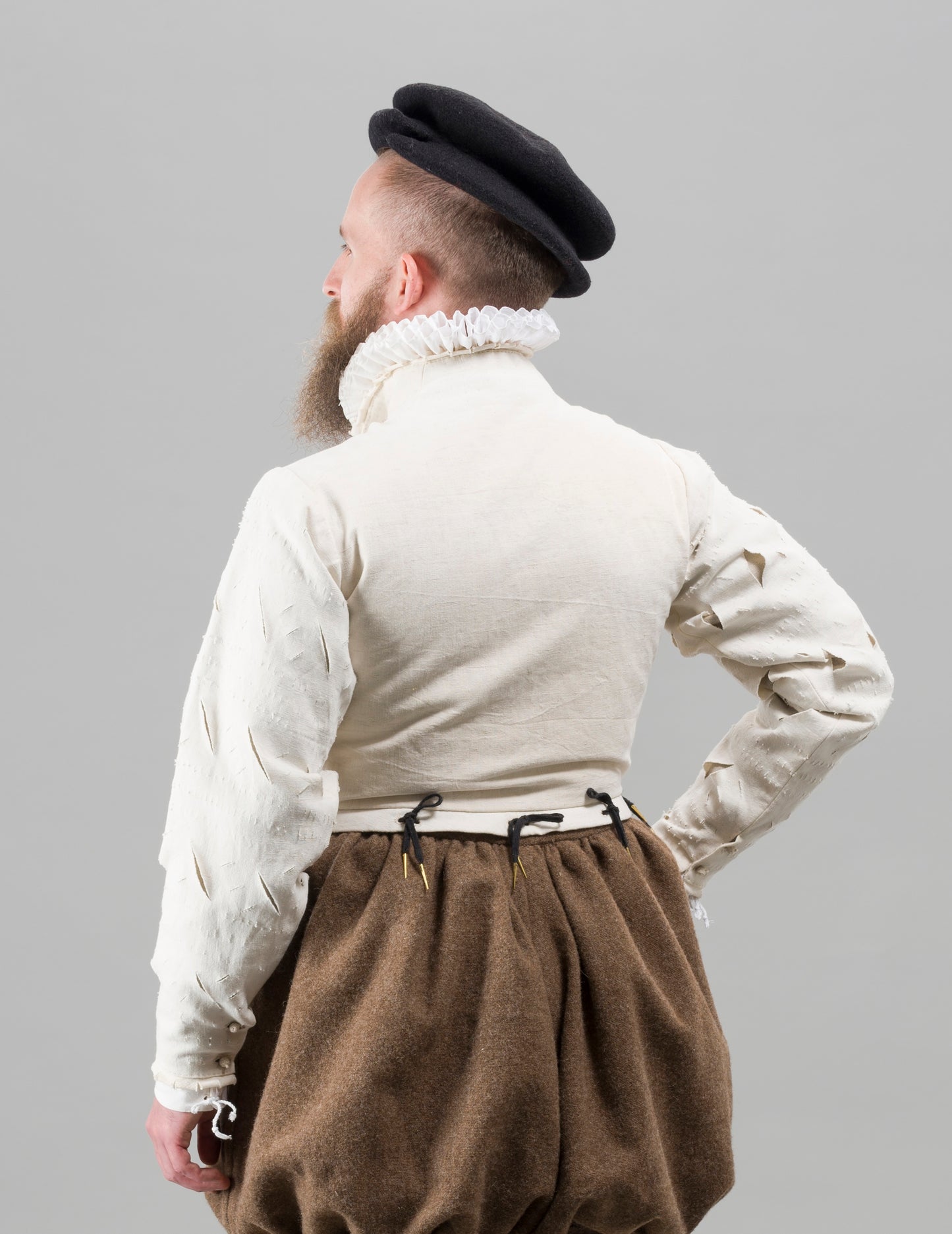 Finished garment - Man's mid-century slashed canvas doublet as featured in The Typical Tudor